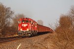 WWA job crests the hill approaching O'Connor Rd. with a trio of EMDs and a string of Herzog loads